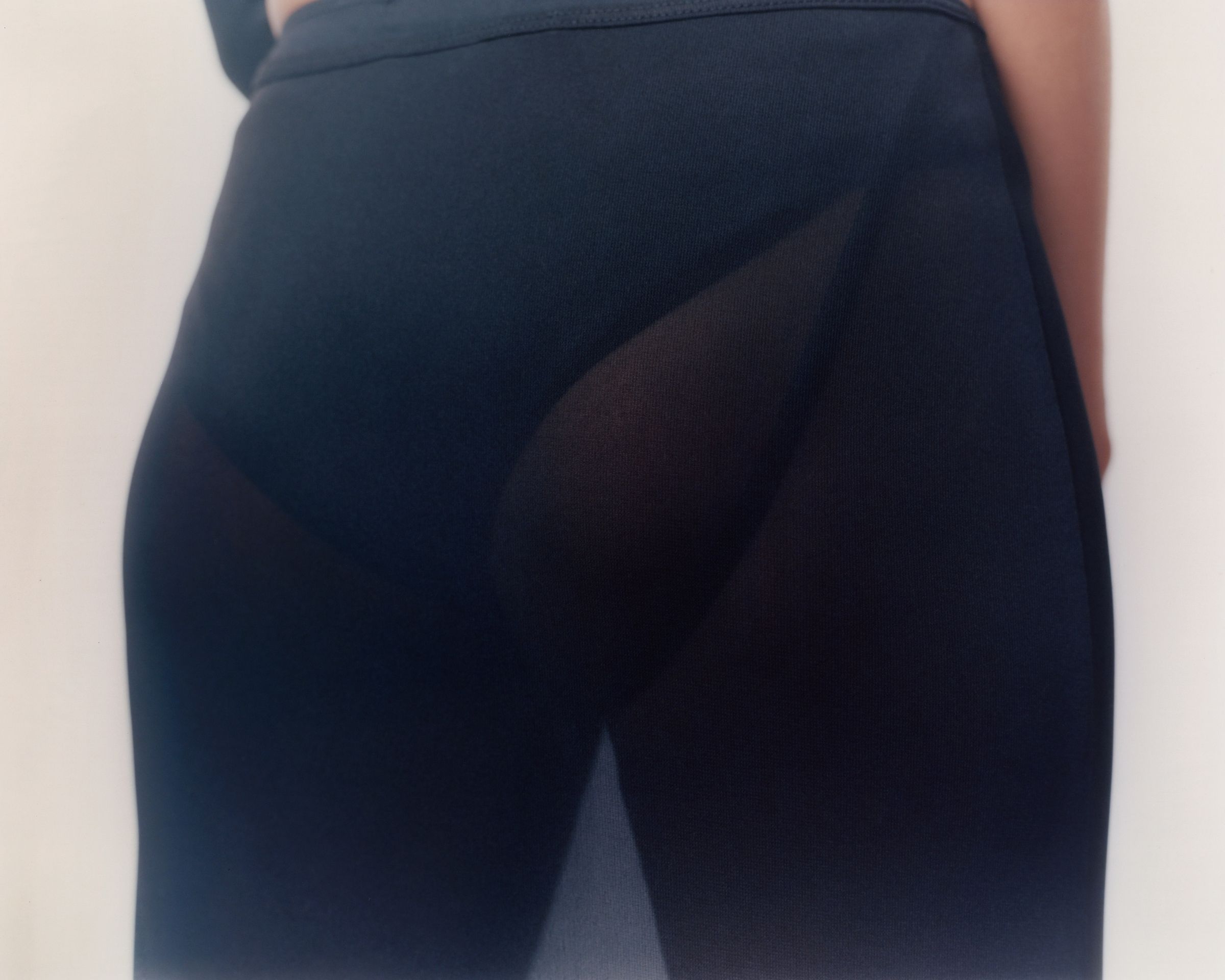 Tank Air SS20 Ready-to-Wear shot in Los Angeles by Erika Kamano. Model in the Sheer Sarong in studio in back detail shot.