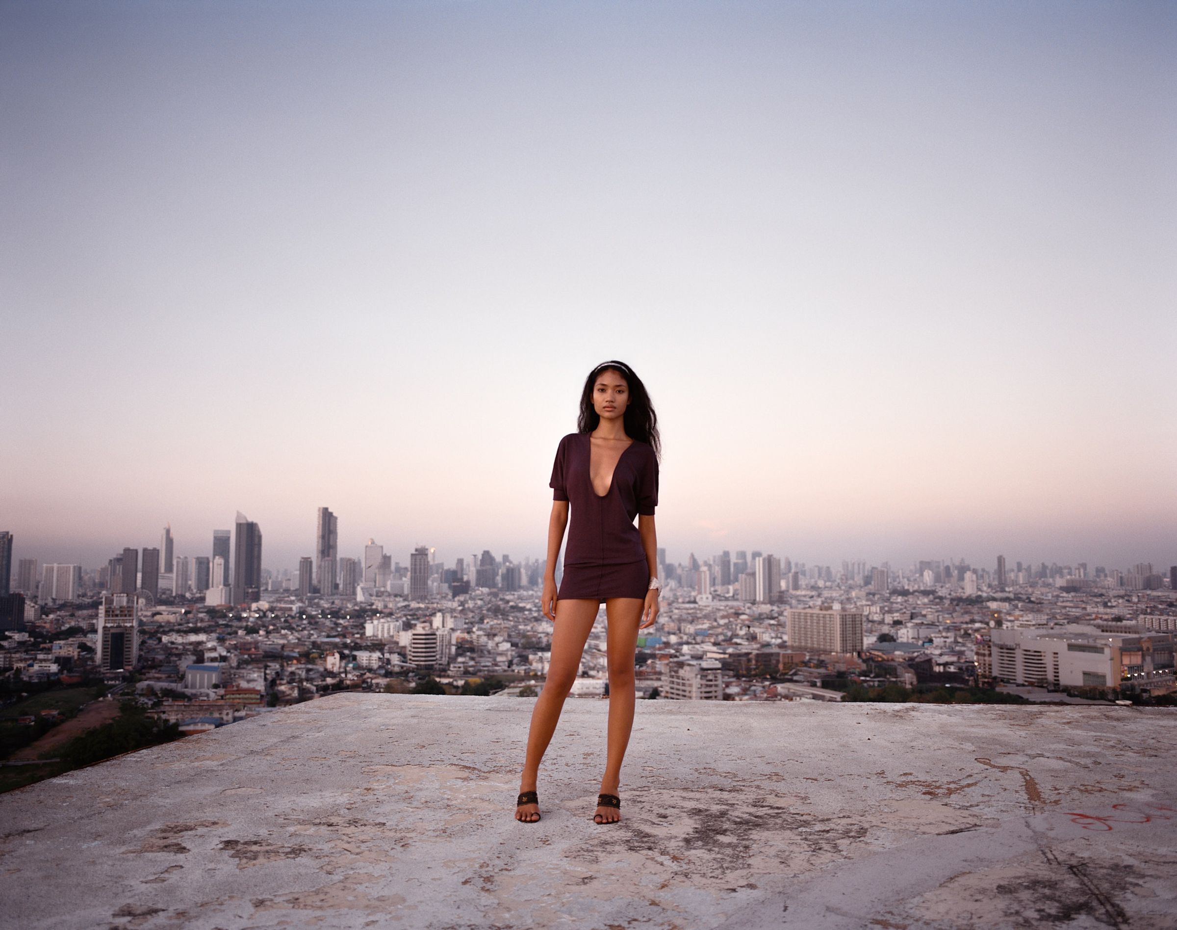 Tank Air SS25 ready-to-wear shot in Bangkok by Erika Kamano & Tank Air. Model wearing the Raindrop Knit in Mangosteen on Bangkok rooftop.