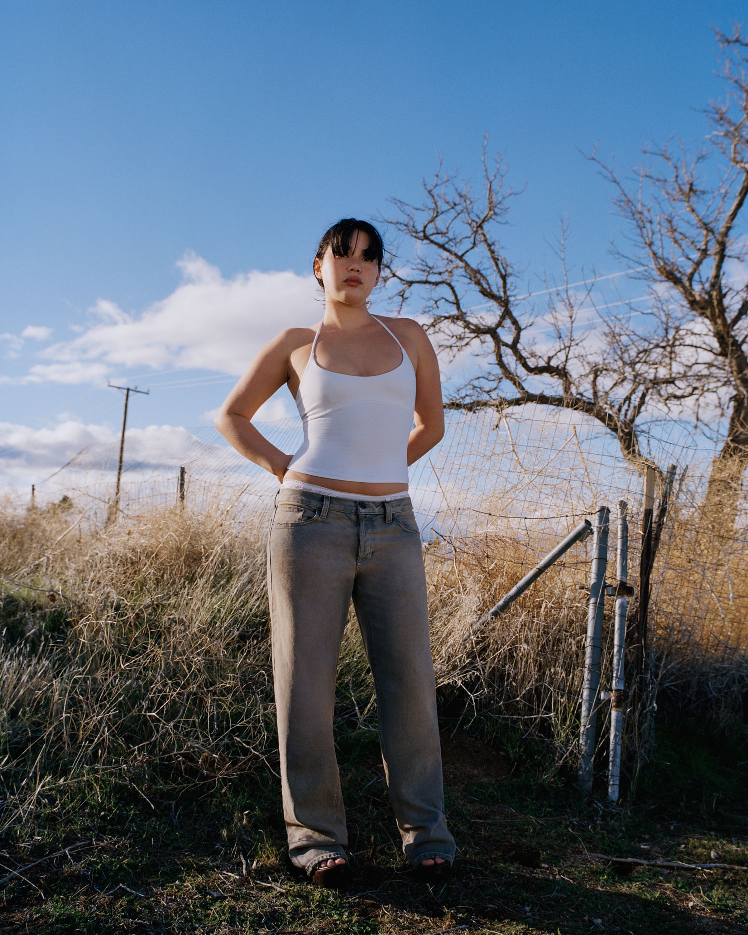 Tank Air SS24 Denim shot in Los Angeles by Tank Air. Model wearing the Low Slung Jeans while standing in nature.