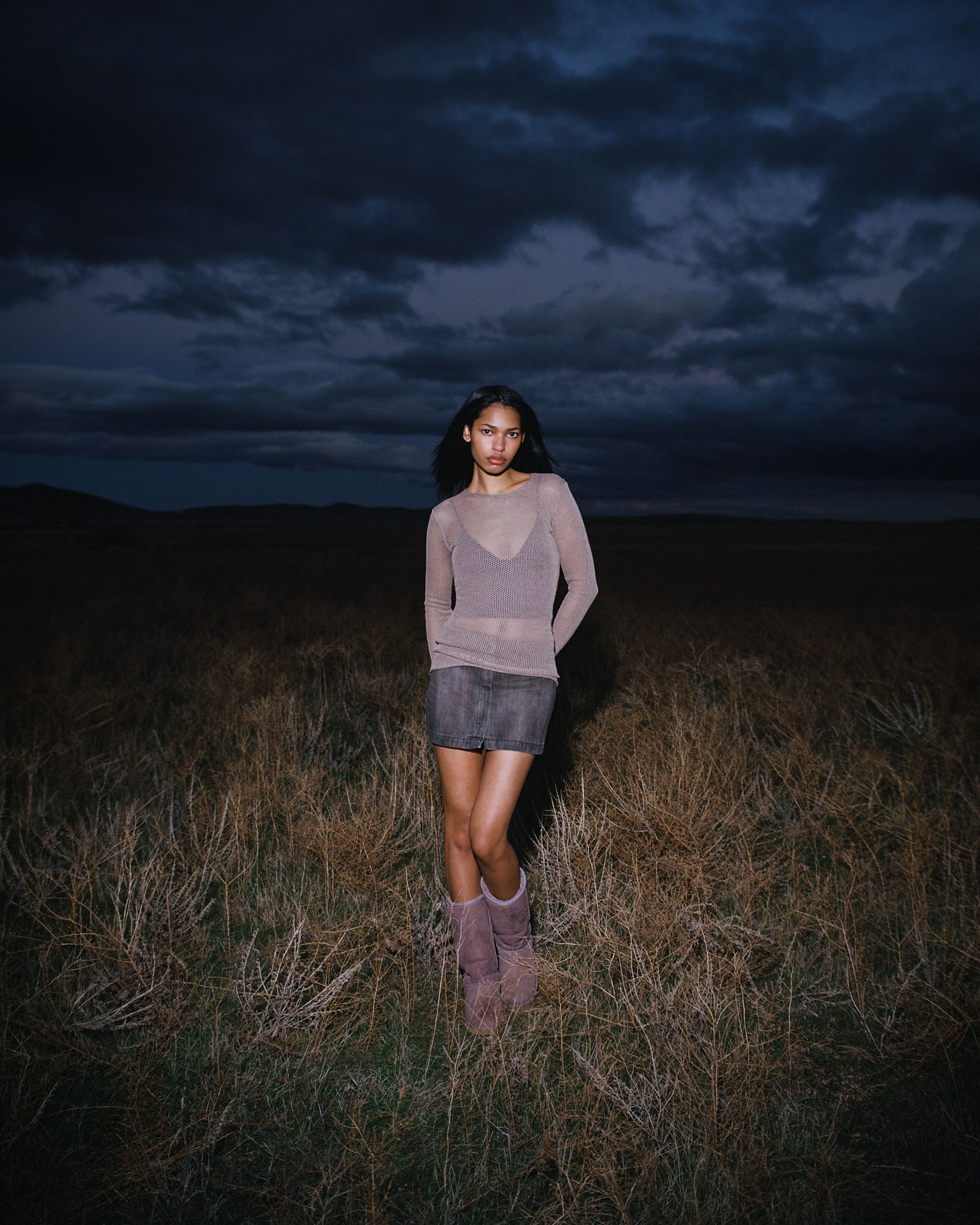 Tank Air SS24 Denim shot in Los Angeles by Tank Air. Model wearing the Denim Mini Skirt while standing in field.