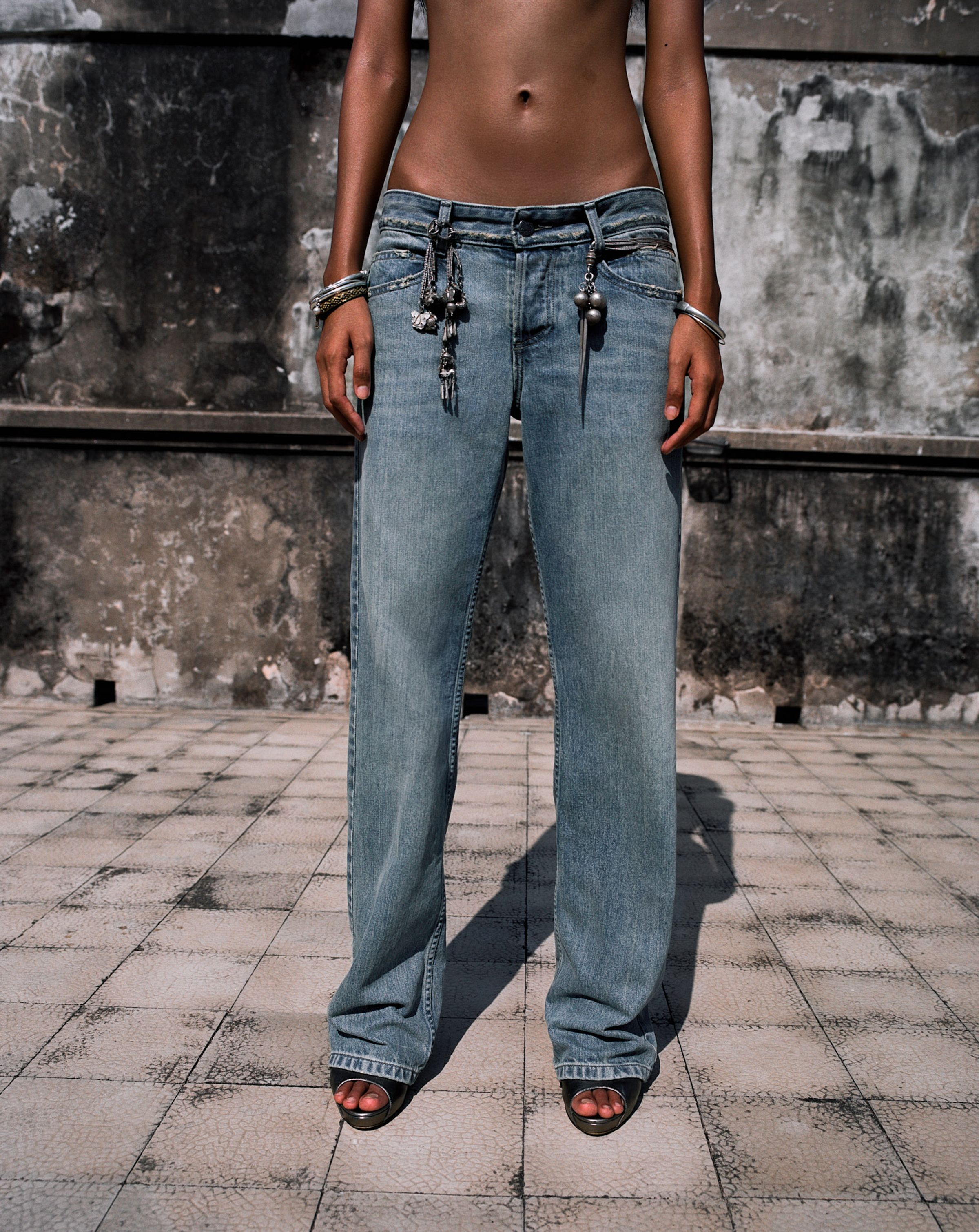 Tank Air SS25 ready-to-wear shot in Bangkok by Erika Kamano & Tank Air. Model wearing the Sabai Sabai Jeans in a detail shot.