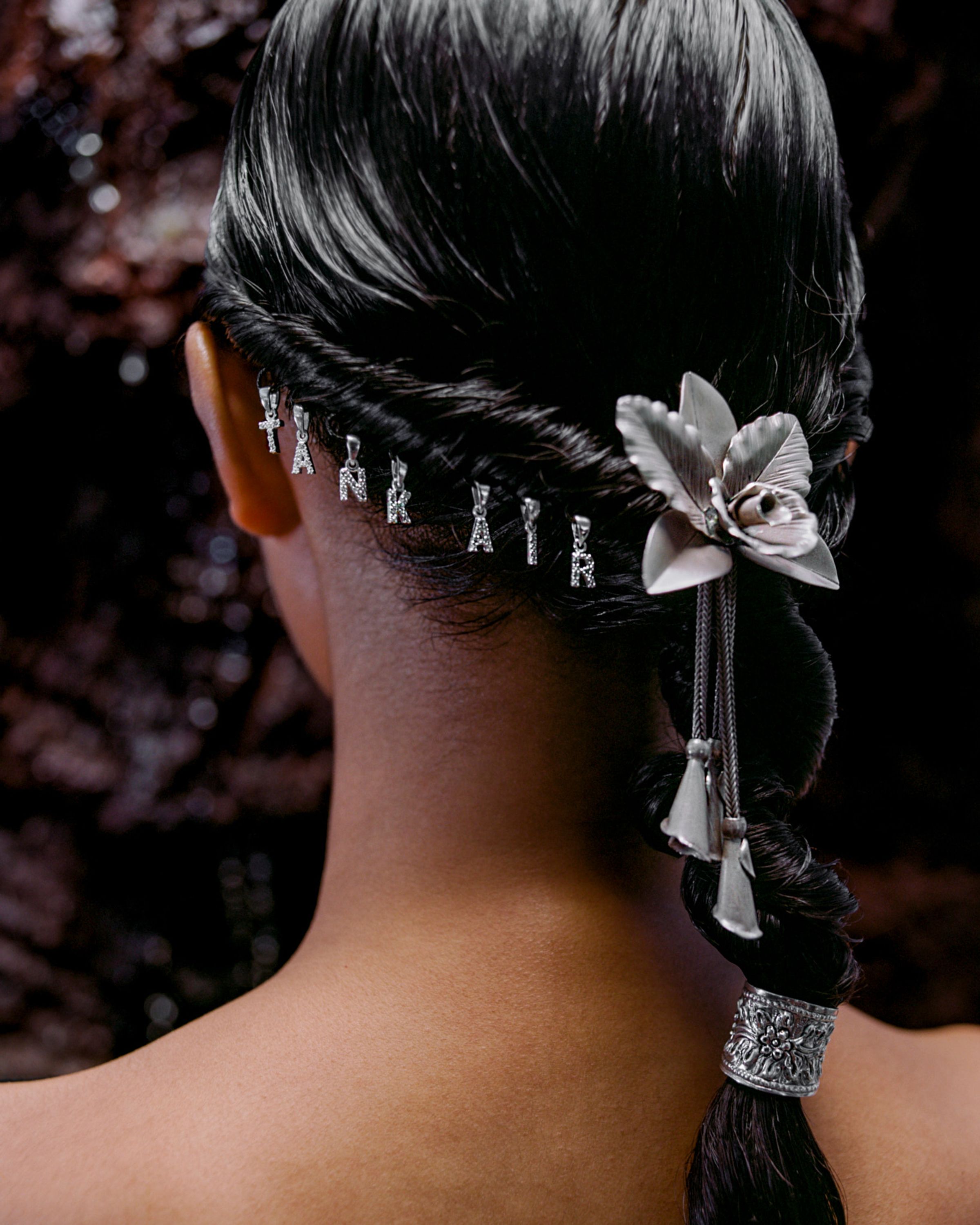 Tank Air SS24 ready-to-wear shot in Bangkok by Erika Kamano. Detail view of hair styled with "Tank Air"and Flower silver jewelry.
