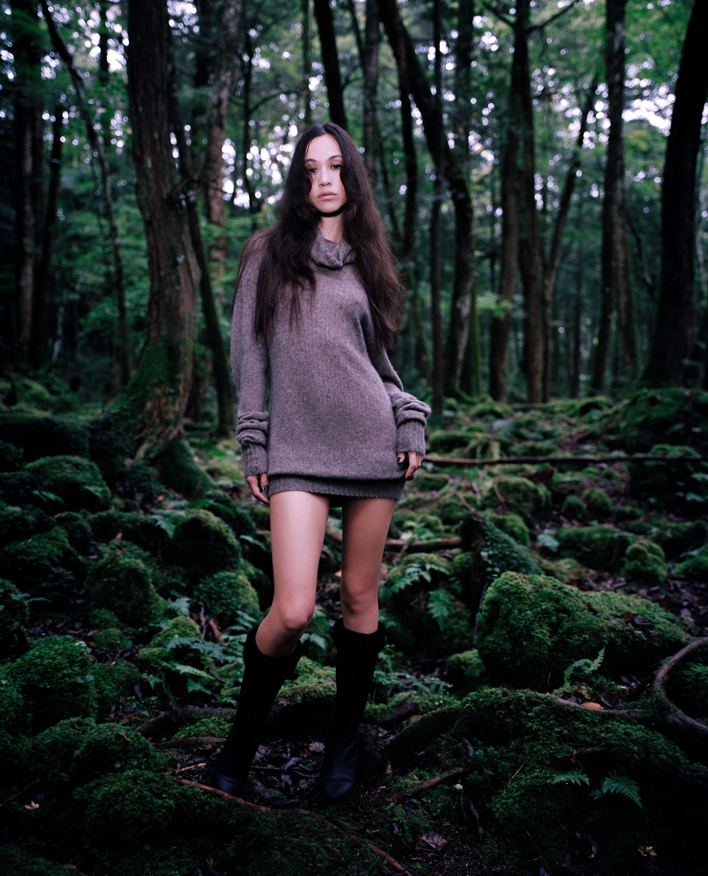 Tank Air FW24 ready-to-wear shot in Tokyo by Erika Kamano. Model wearing the Slouch Cashmere Knit Mini Dress in Mushroom in a mossy forest.