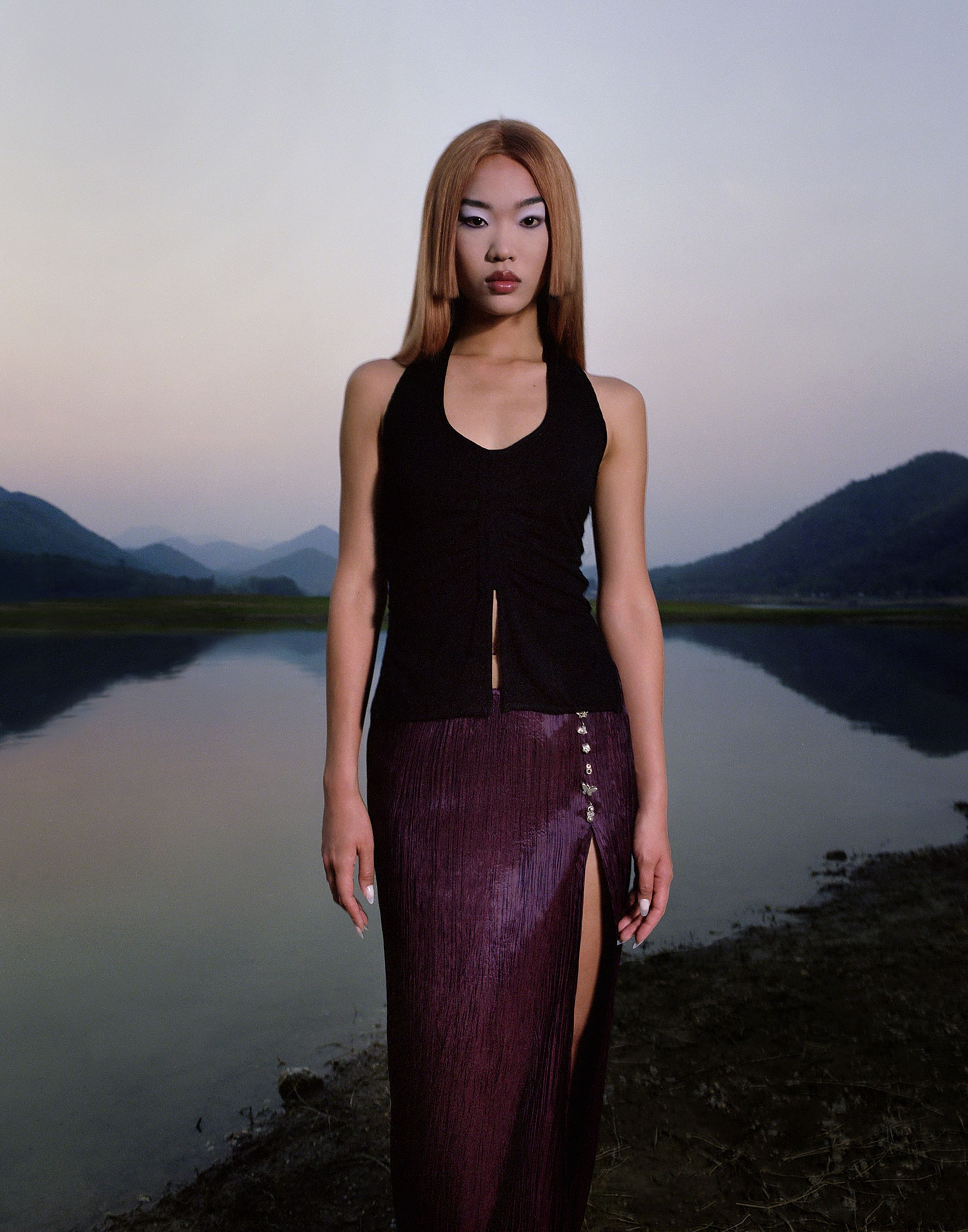 Tank Air SS23 Ready-to-Wear shot in Bangkok by Erika Kamano. Model wearing the Patch Halter and the Thai Pleated Skirt in nature.