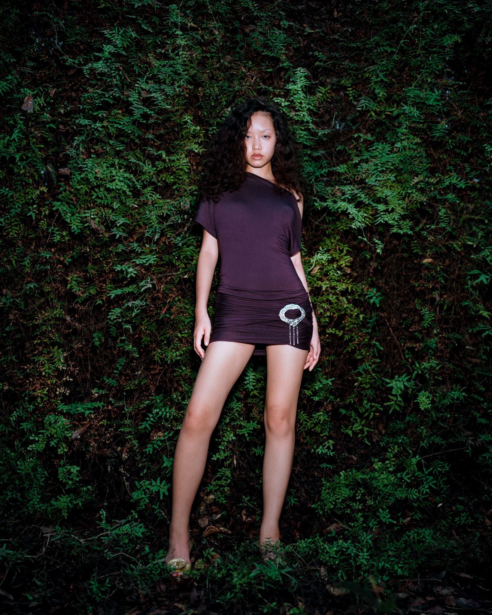 Tank Air SS24 ready-to-wear shot in Bangkok by Erika Kamano. Model wearing the Northern Silver Mini Dress in Eggplant in tropical forest.