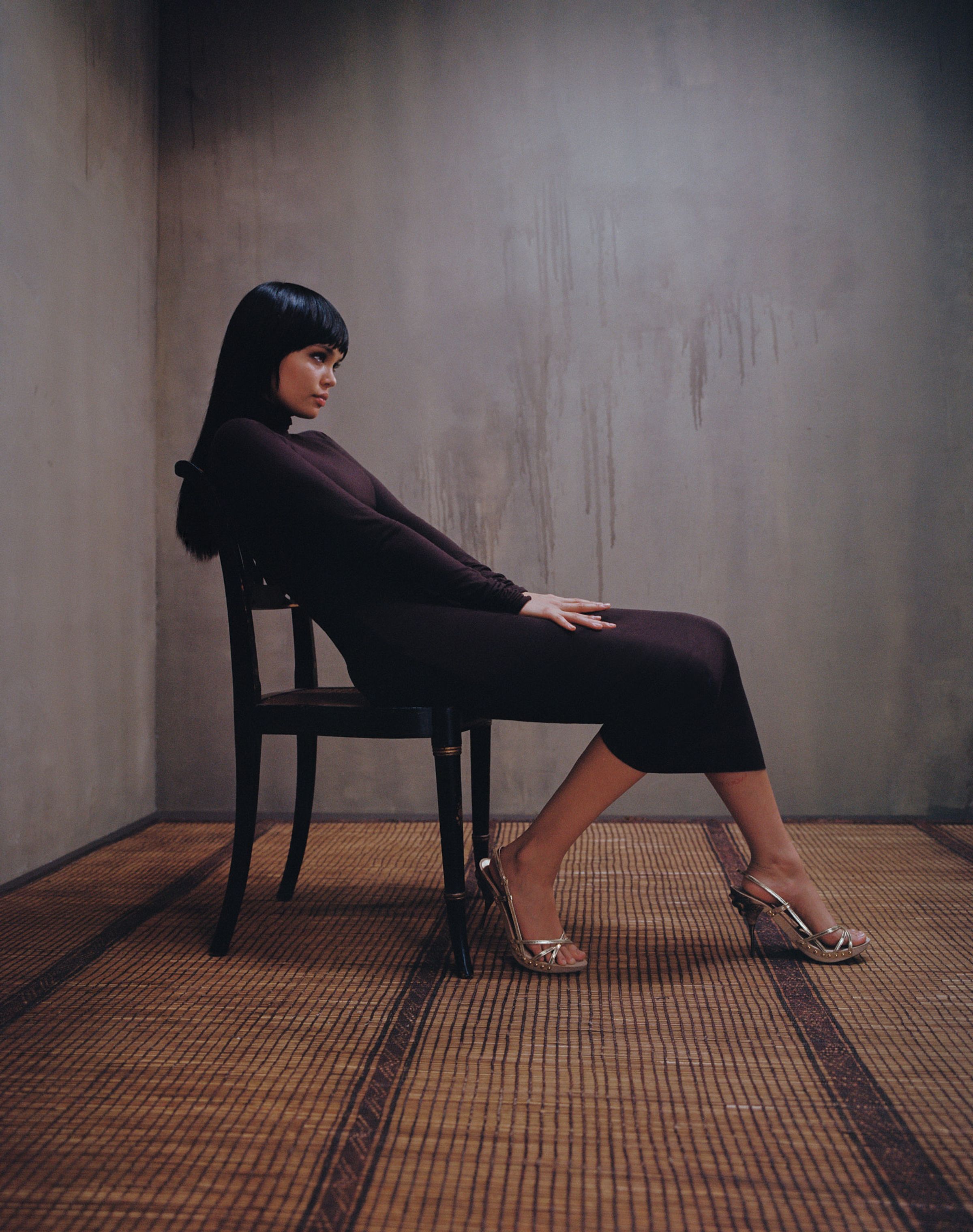 Tank Air FW23 ready-to-wear shot in Los Angeles by Erika Kamano. Model wearing the Double Scrunch Dress in Chocolate while sitting on chair.