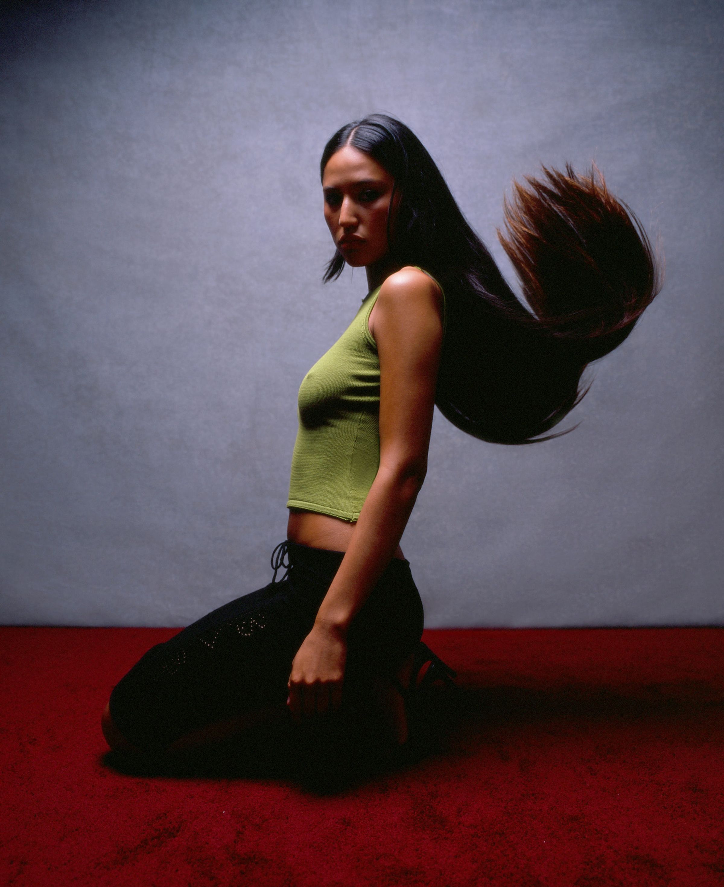 Tank Air SS22 Ready-to-Wear shot in Los Angeles by Erika Kamano. Model wearing the Butterfly Top in Pandan and the Butterfly Midi Skirt in Black crouching in studio.