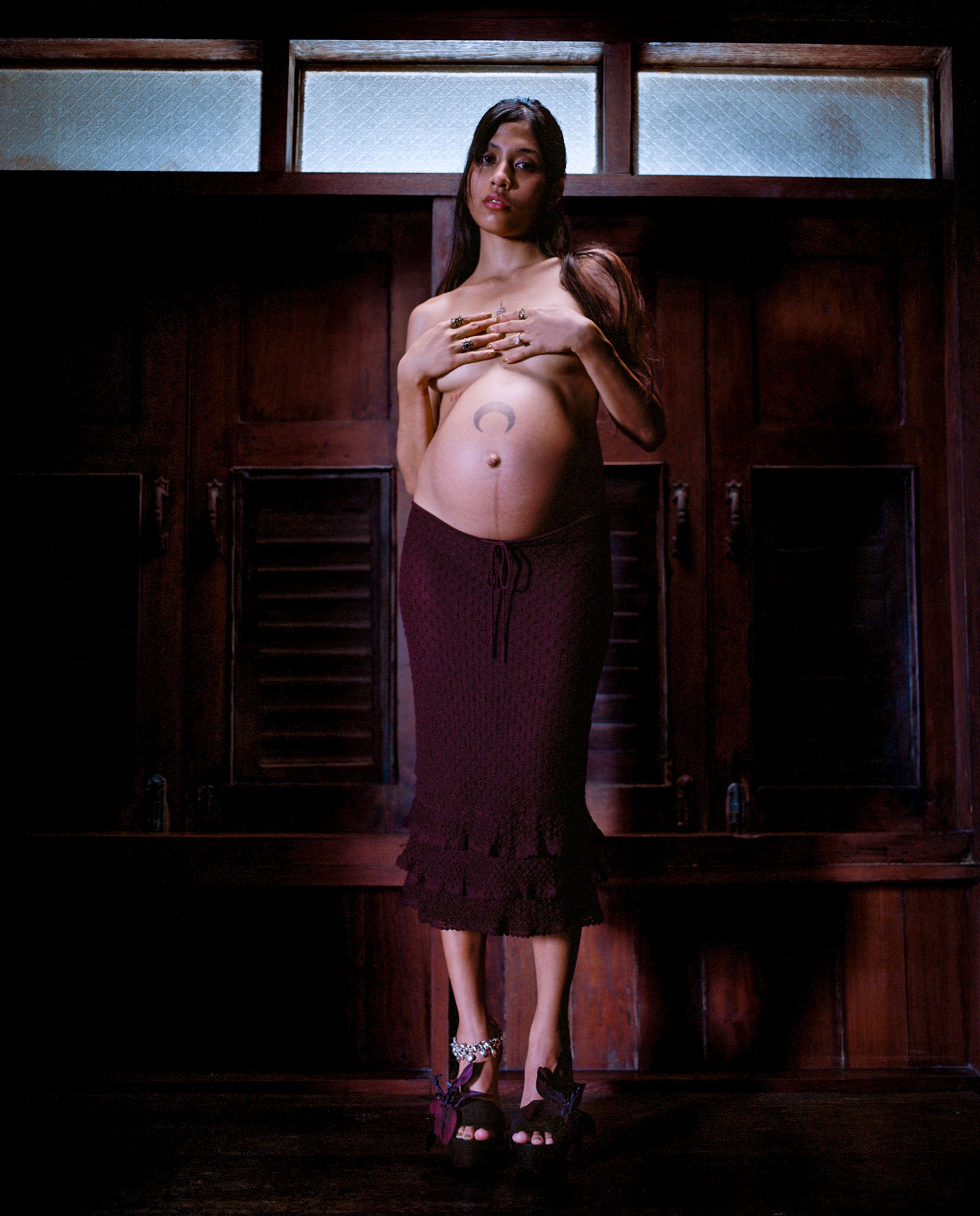 Tank Air SS24 ready-to-wear shot in Bangkok by Erika Kamano. Pregnant Model wearing the Jellyfish Midi Skirt in Dark Plum in room.
