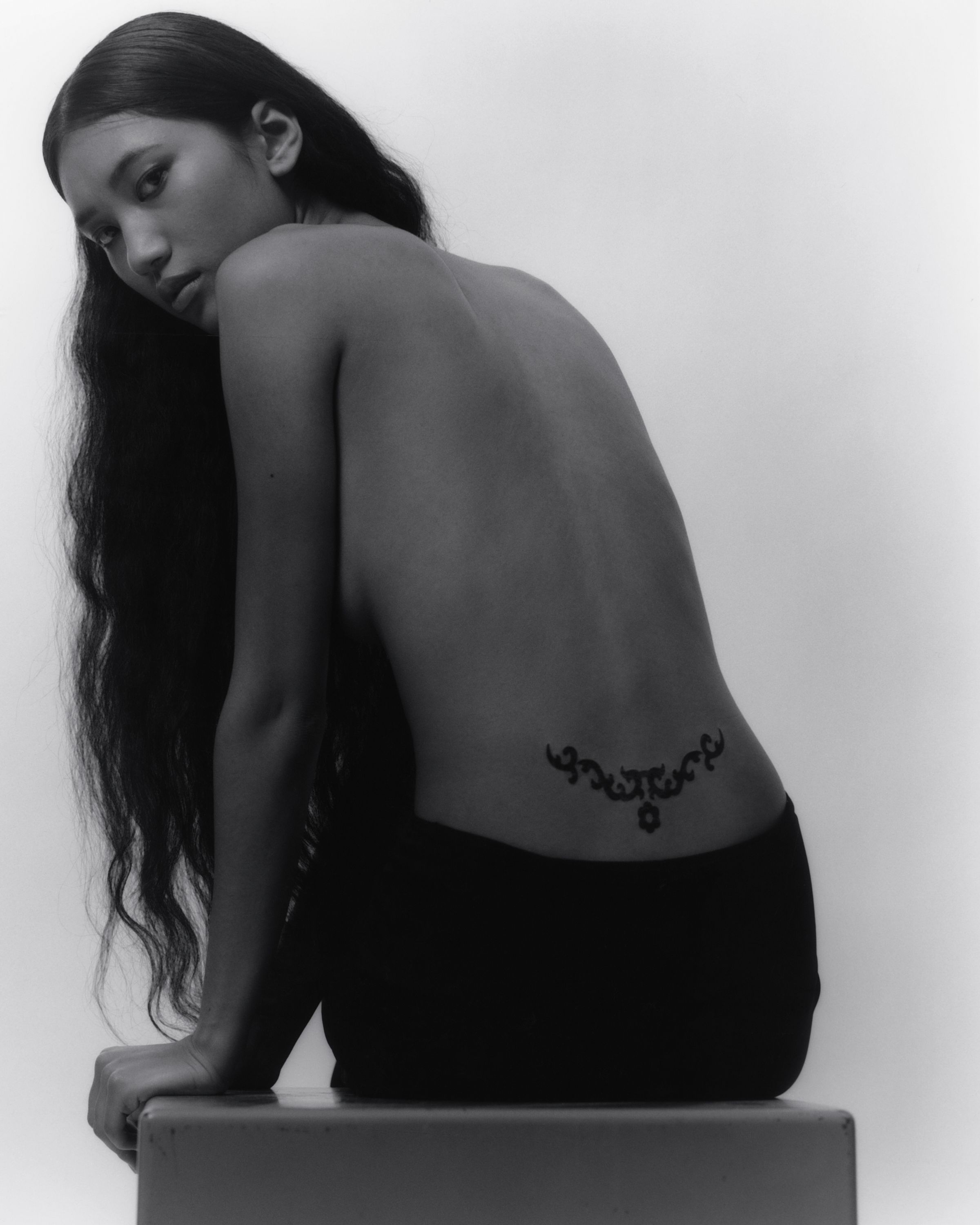 Tank Air SS20 Ready-to-Wear shot in Los Angeles by Erika Kamano. Model wearing the Ceremony Temporary Tattoo in studio in a back view.