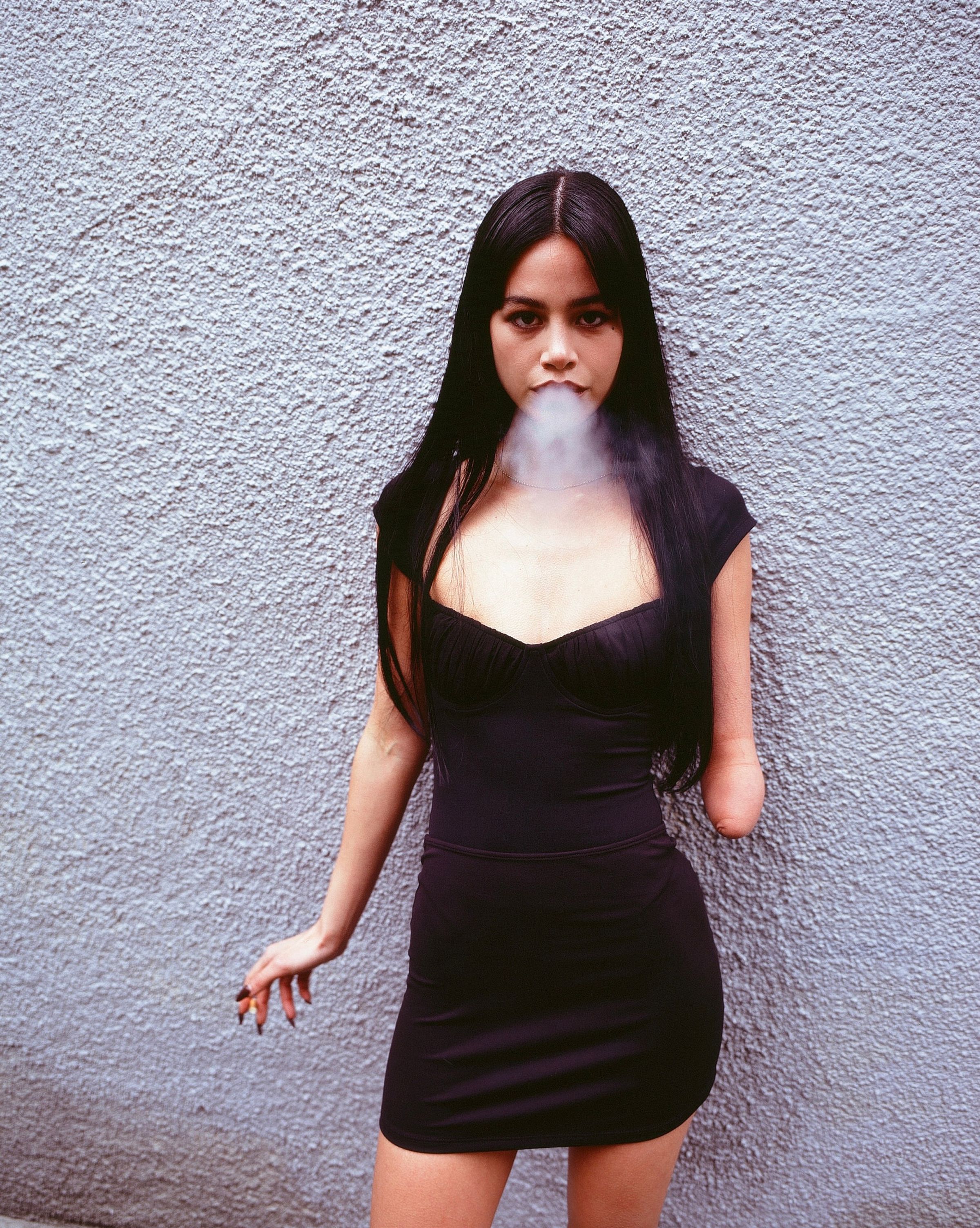 Tank Air SS21 Ready-to-Wear shot in London by Erika Kamano. Model wearing the Juliet Bodysuit in Black on street while smoking.