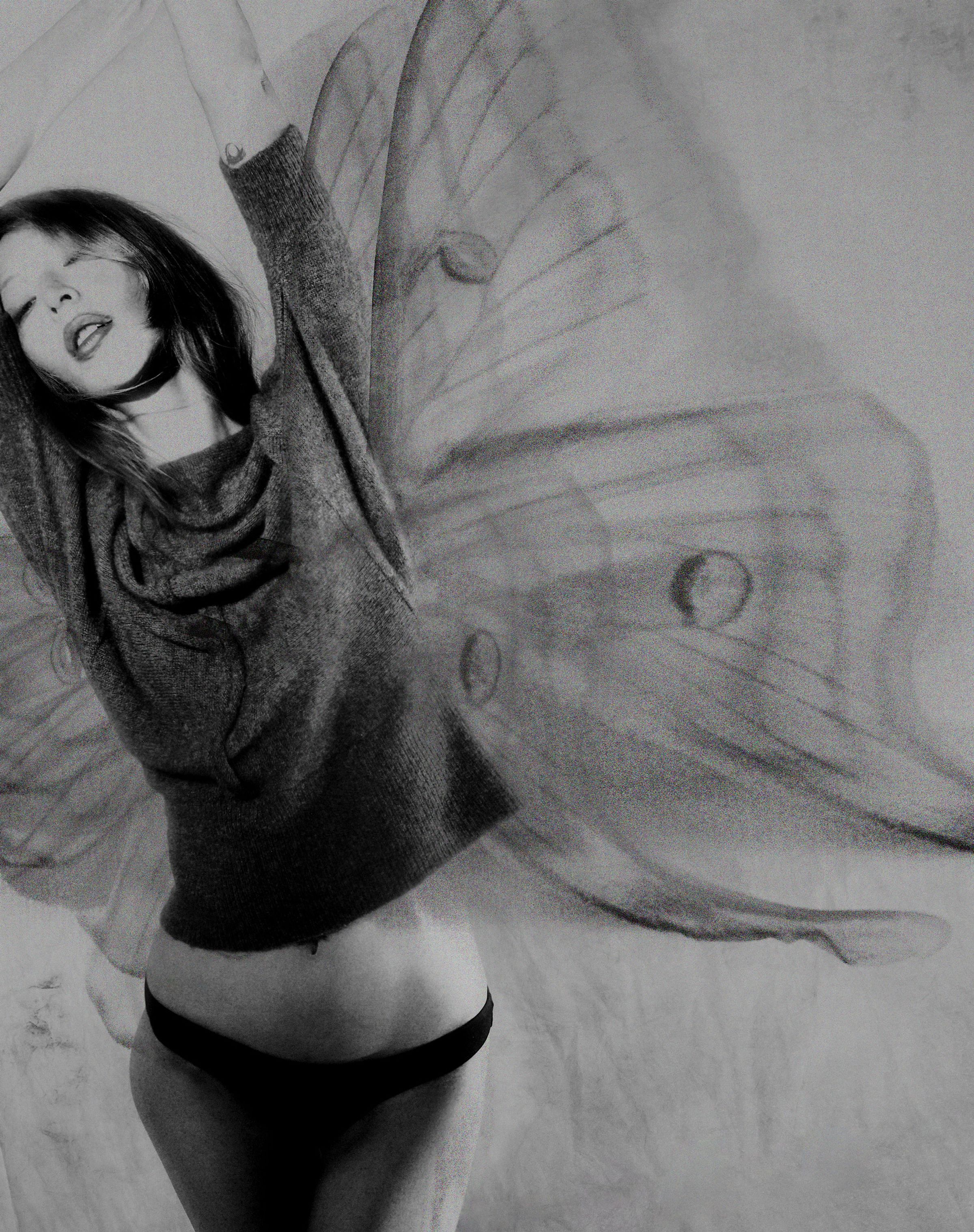 Tank Air FW25 ready-to-wear shot in Paris by Joe Lai. Model wearing the Cashmere Angel Sweater with pictured moth wings behind her body.