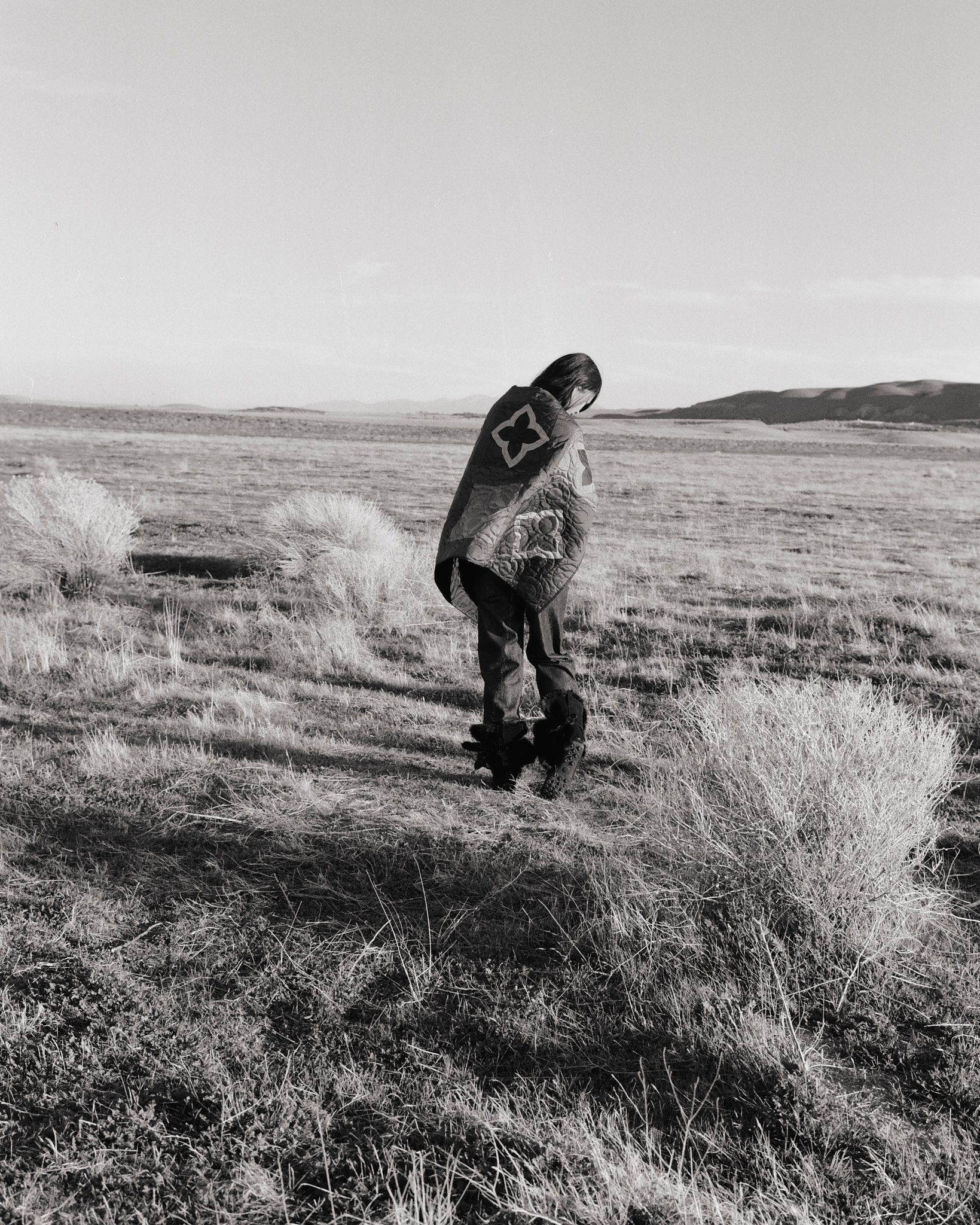 Tank Air SS26 Denim shot in Los Angeles by Tank Air. Model wearing denim star blanket in field.