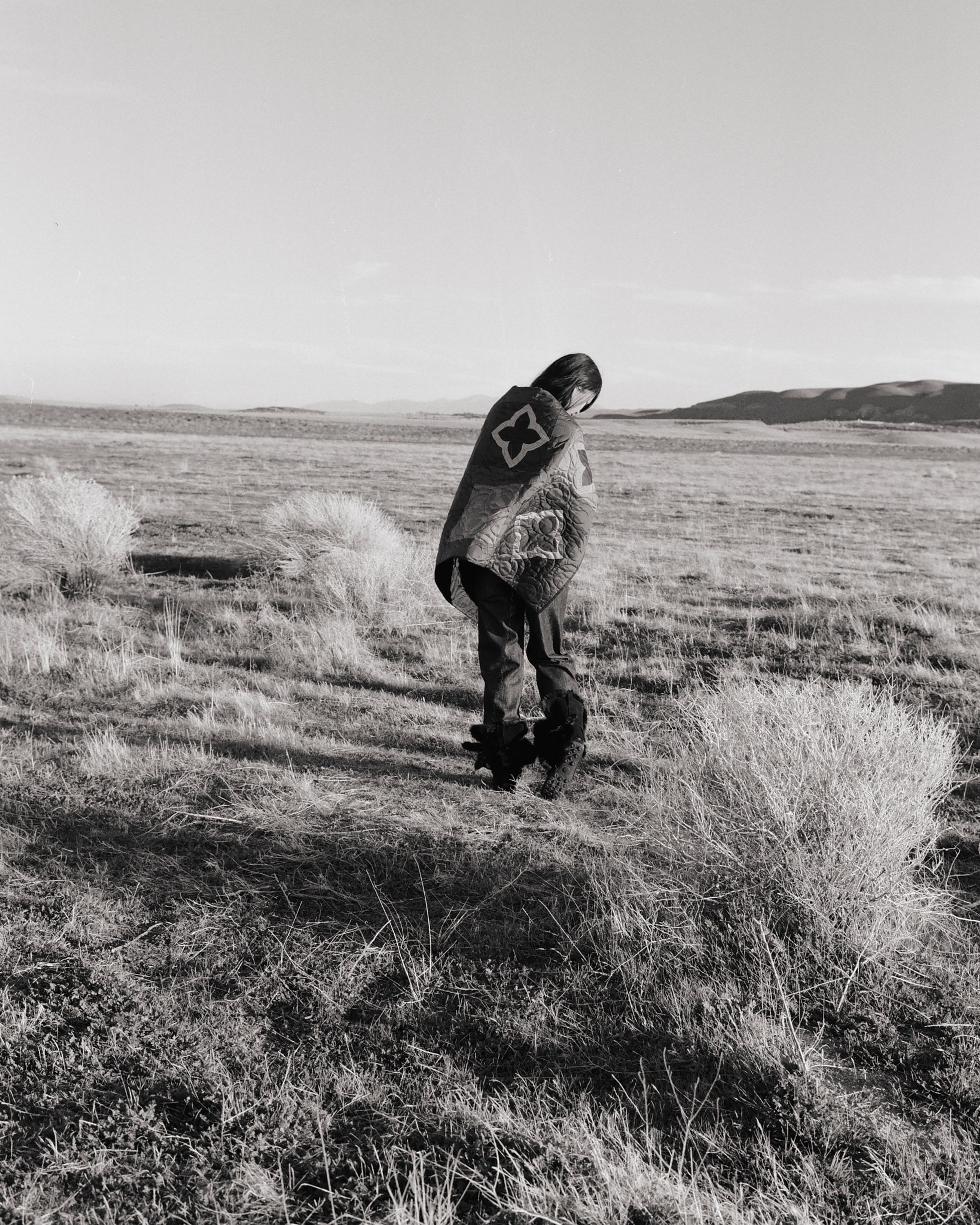 Tank Air SS26 Denim shot in Los Angeles by Tank Air. Model wearing denim star blanket in field.